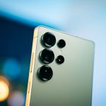 A close up of a cell phone with a blurry background