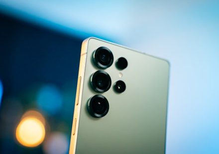 A close up of a cell phone with a blurry background